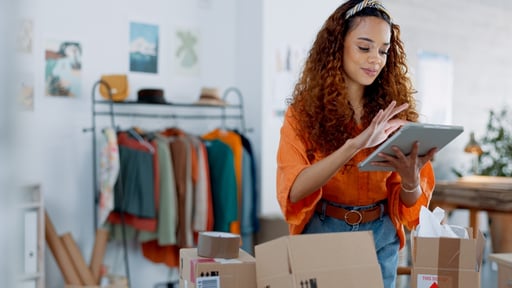 Store-owner-looking-at-tablet-customer-journey